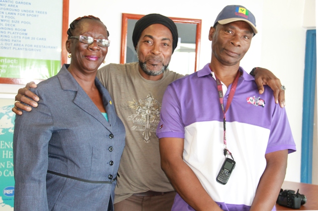 Sylvester Meade, the Ministry of Tourism’s 2016 Photographer of the Year flanked by (l) Marilyn Pemberton and (r) Antonio Brown of the Nevis Craft House who designed and constructed frames for his photographs mounted at the Vance W. Amory International Airport on May 31, 2016