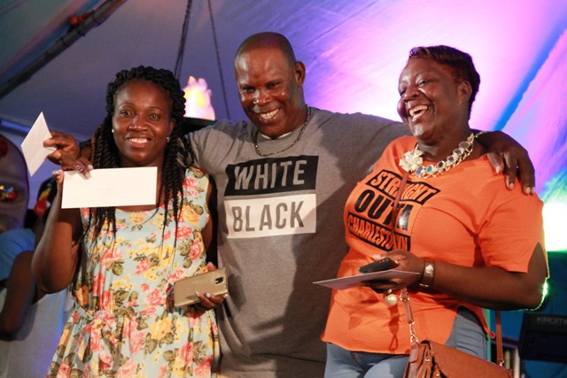 Die-hard patrons of Culturama (l-r) Julie Prentice, Sylvester Pemberton and Shelly Taylor moments after they were presented with tickets to attend shows during Culturama 42 during the launch of Culturama 42 at the Charlestown waterfront on July 21, 2016