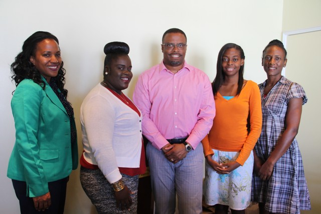 Deputy Premier of Nevis and Minister of Health Hon. Mark Brantley (middle) flanked by the 2016/17 MUA/NIA scholarship awardees and Ministry of Health officials (l-r) Permanent Secretary Nicole Slack-Liburd, Laurencia Walters, Nicoyann Blackett and Health Planner Shelisa Martin-Clarke at the Alexandra Hospital conference room on July 19, 2016