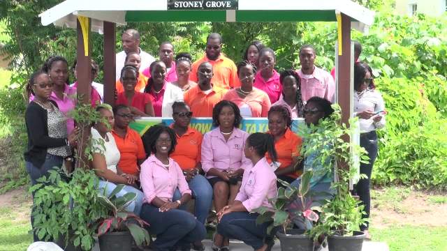 Staff of the Inland Revenue Department at the newly commissioned bus stand on the Island Main Road near Horsford’s Valu Mart on August 12, 2016, adopted by the department