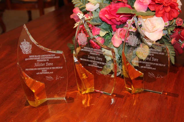 The three tokens of recognition presented to the Dore Brothers for their contribution to Music on Nevis at the St. Christopher and Nevis Social Security Board’s conference room at Pinney’s on October 25, 2016