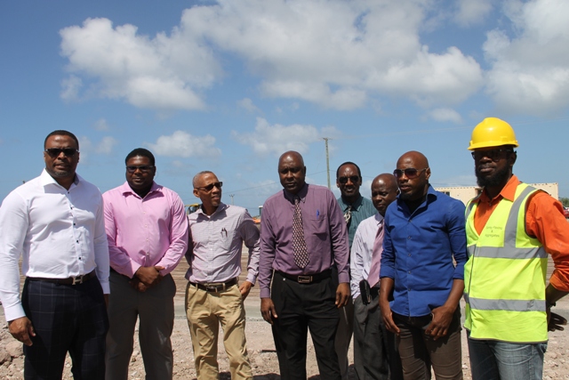 (l-r) Hon. Mark Brantley, Deputy Premier and Minister of Sports and Tourism on Nevis, Junior Minister in the Ministry of Communication and Works Hon. Troy Liburd, Legal Advisior Colin Tyrell, Cabinet Secretary Stedmon Tross, Assistant Secretary in the Premier’s Ministry Kevin Barret, Permanent Secretary in the Premier’s Ministry Wakely Daniel, Tim Caines, Project Manager and Michael Morrison Construction Manager for Surrey Paving and Aggregate Co. Ltd. at the Mondo track construction site at Long Point on February 08, 2016