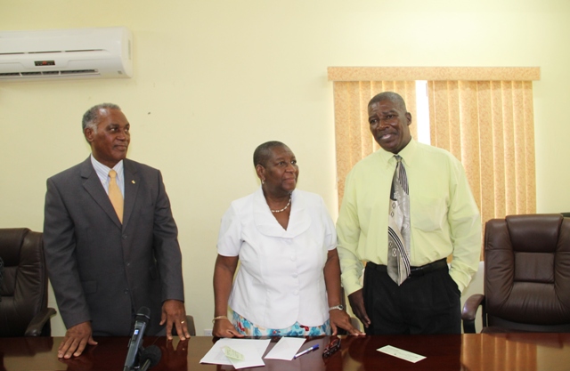 (l-r) Hon. Vance Amory, Premier of Nevis and Minister of Education in the Nevis Island Administration, Dr. Robertine Chaderton, Chairman of the St. Kitts and Nevis Sugar Industry Diversification Foundation Board of Counsellors and Edson Elliott, Principal of the Charlestown Secondary School and the Nevis Sixth Form College at a handing over ceremony at the Ministry of Finance conference room in Charlestown on February 17, 2017