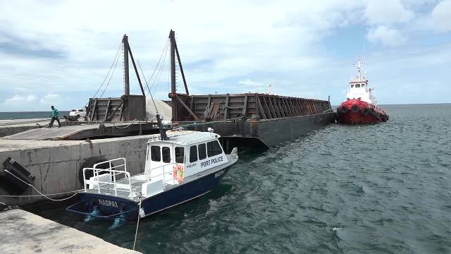 The barge carrying the 3,000 tons of aggregate from the quarry at New River to St. Maarten, docked at the Long Point Port on February 28, 2017