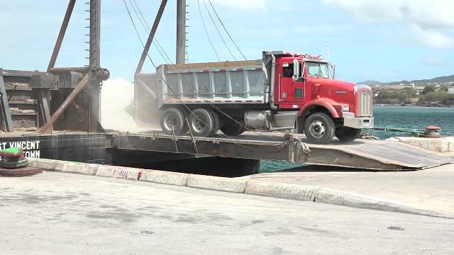 Some of the 3,000 tons of aggregate from the quarry at New River being offloaded on a barge at the Long Point Port on February 28, 2017