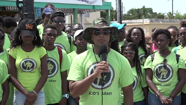 Youth Pastor Colin Gunthrope of the New Life Baptist Church in Tortola at the Charlestown Pier on July 03, 2017, leading a group of youth members of his church