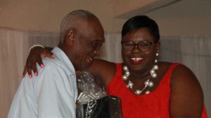 Hon. Hazel Brandy-Williams, Junior Minister in the Ministry of Social Development presents a gift basket to Mr. Clefrin “Shine” Daniel, one of five men honoured for their contribution to cultural preservation on Nevis