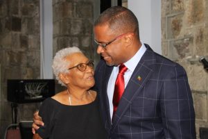 New Premier of Nevis Hon. Mark Brantley shares a tender moment with Lady Sheila Daniel who he says is a mother to him after he was sworn in as premier of Nevis at the High Court in Charlestown on December 19, 2017