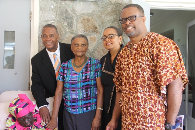 Senator Wendy Phipps, Minister of State in the Ministry of Health in the Federal Government (second from right) with the Federation’s oldest living centenarian Celian “Martin” Powell at her 106th birthday celebration on January 19, 2018, at the Flamboyant Nursing Home. She is flanked by (l-r) Hon Eric Evelyn Minister of Community Development on Nevis, Her Honour Mrs. Marjory Morton, Acting Deputy Governor General and Hon. Mark Brantley, Premier of Nevis