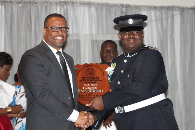 Hon. Mark Brantley, Premier of Nevis and Minister of Security presents Constable of the Year award to Constable Leon Michael, at the Royal St. Christopher and Nevis Police Force, Nevis Division’s 18th annual Constable’s Award Ceremony and Dinner on March 10, 2018, at the Occasion’s Entertainment Arcade at Pinney’s Estate