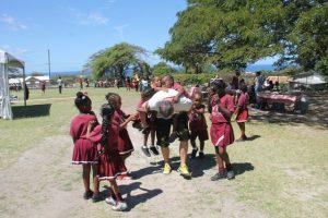 A member of the Galderma Group visiting Nevis interacts with students at the Ivor Walters Primary School at Brown Hill on February 28, 2018