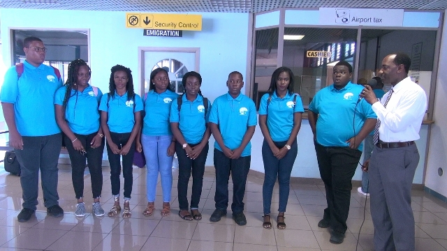 (extreme right) Permanent Secretary in the Ministry of Education Mr. Kevin Barrett with Team Nevis Debaters at the Vance W. Amory International Airport, on their way to defend their championship title at the 46th Leeward Islands Debating Competition in Anguilla
