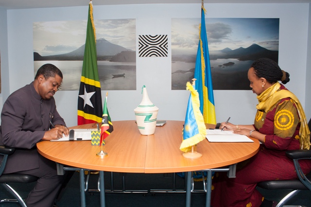 (l-r) His Excellency Dr. Kevin M. Isaac, St. Kitts and Nevis High Commissioner to the United Kingdom and Her Excellency Ms. Yamina Karitanyi, High Commissioner of Rwanda to the United Kingdom sign mutual the visa waiver agreement in London on behalf of their governments on April 26, 2018