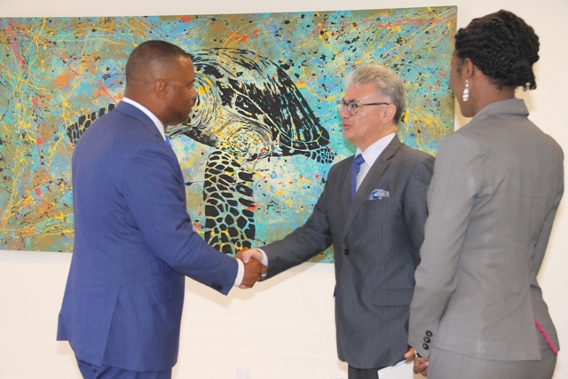 Hon. Mark Brantley, Minister of Foreign Affairs and Aviation welcomes His Excellency Ambassador Carlos Jativa, Permanent Representative of Ecuador to the International Organization in Vienna to his Pinney’s Estate office on April 04, 2018. Mrs. Sonia Boddie-Thompson, Foreign Service Officer in the Ministry of Foreign Affairs and Aviation looks on