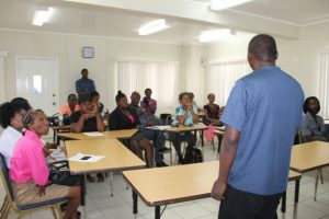 Mr. Timothy Prescott, facilitator of the Small Business Enterprise Unit Essential Oils Workshop in session with participants on May 09, 2018, at the Credit Union Conference Room