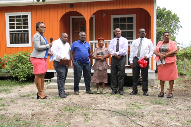 (l-r) Ms. Shelly Liburd, who oversees community housing assistance projects in the Ministry of Social Development; Pastor Ron Daniel, Hillary Shield; Ms. Lorraine Cassandra Phillip; Hon. Eric Evelyn, Minister of Social Development in Nevis; and Mr. Keith Glasgow, Permanent Secretary in the Ministry of Social Development at a ceremony to hand over a house to Ms. Phillip on June 14, 2018