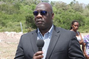 Hon. Alexis Jeffers delivering remarks at the grave-site of the late Hon. Malcolm Guishard at the Bath Cemetery, on the occasion of the 11th anniversary of his passing