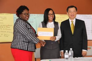 (l-r) Hon. Hazel Brandy-Williams, Junior Minister of Health in the Nevis Island Administration hands over cheque from the Republic of China (Taiwan) on June 12, 2018, at the Franklin Browne Community Centre in Newcastle to Mrs. Nicole Slack-Liburd, Permanent Secretary in the Ministry of Health while His Excellency George Gow-Wei, Ambassador of the Republic of China (Taiwan) to St. Kitts and Nevis looks on