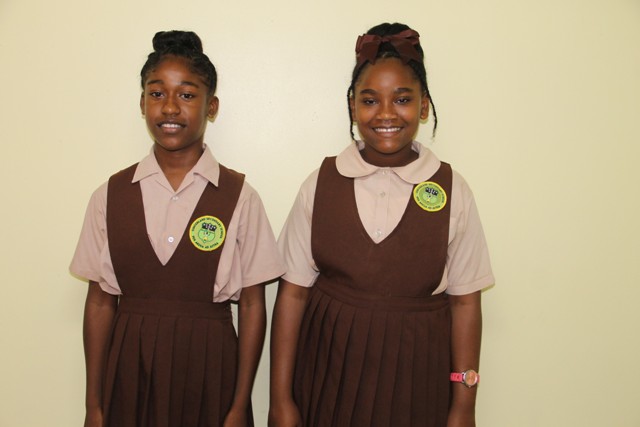 Winners of the local leg of the 2018 Florida Caribbean Cruise Association Essay Contest on Nevis: (l-r) Ms. Jareecia Browne, winner in the Senior Category; and Dericia Williams, winner in the Junior Category; both students are from the Gingerland Secondary School