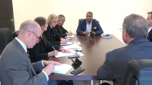 Hon. Mark Brantley, Premier of Nevis and Mrs. Hélène Ann Lewis, Legal Adviser to the NIA (to his immediate left) meeting with representatives of the Overseas Private Investment Corporation (OPIC) based in Washington (left), and geothermal developers of Nevis Renewable Energy International (right) at his office at Pinney’s Estate on July 30, 2018