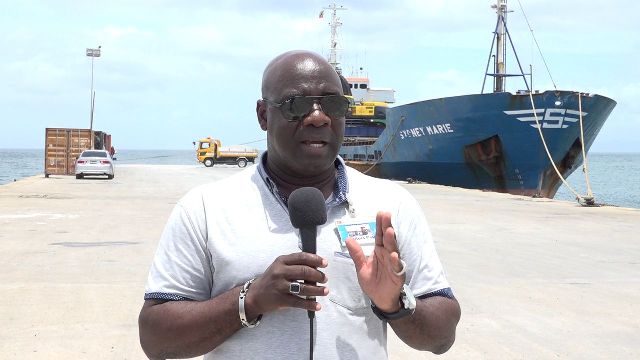 Hon. Alexis Jeffers, Minister of Natural Resources on Nevis and Chairman of the Nevis Housing and Land Development Corporation Board of Directors, at the Long Point Port on August 17, 2018 where a barge is loading up for the second time with aggregate from Nevis bound for Guyana
