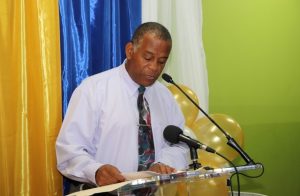 Hon. Eric Evelyn paying tribute to the late Mr. Brian Anthony David at a renaming ceremony by the Customs and Excise Department on Nevis on October 25, 2018, on the occasion of the 60th anniversary of the St. Kitts and Nevis Customs and Excise Department