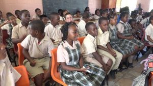 Students at the Charlestown Primary School singing with seniors during the Intergenerational Exchange at the school on October 23, 2018