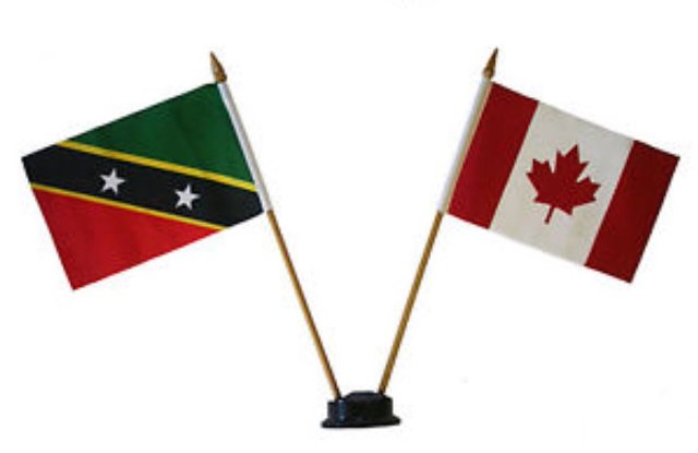 (l-r) Flags of St. Kitts and Nevis and Canada