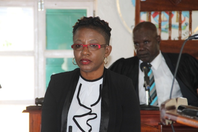 Ms. Myra Williams, Clerk of the Nevis Island Assembly at a sitting of the Nevis Island Assembly with Hon. Farrel Smithen President of the Assembly in the background (file photo)