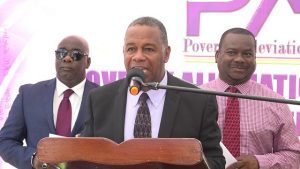 Hon. Eric Evelyn, Minister of Social Development in the Nevis Island Administration flanked by (left) Hon. Alexis Jeffers, Deputy Premier of Nevis and (right) Mr. Keith Glasgow, Permanent Secretary in the Ministry of Social Development at the launch of the Poverty Alleviation Programme on Nevis on December 24, 2018 in Charlestown 