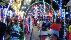 Members of the public savouring the start of the Christmas Season in Charlestown, moments after Mrs. Zaiditor Olive Jeffers of Craddock Road, Patron of the Department of Community Development’s annual Christmas Tree Lighting Ceremony flipped the switch to light up the capital on December 05, 2018