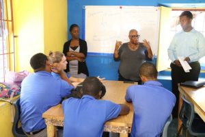 (L-r) Ms. Yahsulazie Grant Production Assistant, Ms. Paula Warner Editor and Mr. Devonne Cornelius Junior News Reporter at the Department of Information, making presentations to students at the Nevis International Secondary School on January 28, 2019 as part of the department’s awareness week of activities