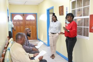 Former NTv newscasters (sitting l-r) Hon. Eric Evelyn and Mr. Huey Sargeant discussing the news package before presenting with Mrs. Donace Wilkinson-Caines, Deputy Director of the Department of Information/anchor and Ms. Fredicia Liburd Assistant News Editor/anchor at the department on January 28, 2019