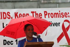 Mrs. Nicole Slack-Liburd, as Health Planner in the Ministry of Health in 2008, delivering remarks at a World AIDS Day rally at Elquemedo T. Willett Park (file photo)