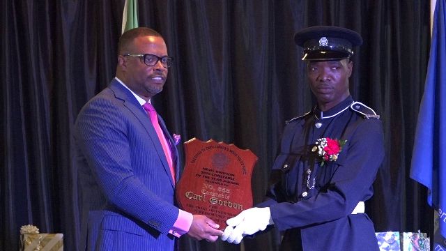 Hon. Mark Brantley, Premier of Nevis presenting the Top Constable 2018 Award and plaque to Constable Carl Gordon of the Criminal Investigation Department at the Royal St. Christopher and Nevis Police Force (Nevis Division) Constable’s Awards Ceremony and Dinner, hosted by the Strategic Planning Group on February 23, 2019, at the Occasions Entertainment Arcade at Pinney’s Estate