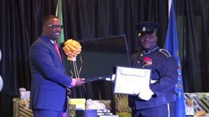 Hon. Mark Brantley, Premier of Nevis presenting second runner up No. 677 Constable Trevin Mills of the Violent Crimes Unit with gifts at the Royal St. Christopher and Nevis Police Force (Nevis Division) Constable’s Awards Ceremony and Dinner, hosted by the Strategic Planning Group on February 23, 2019, at the Occasions Entertainment Arcade at Pinney’s Estate