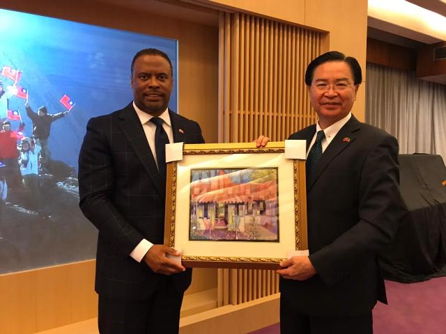 (L-r) Hon. Mark Brantley Minister of Foreign Affairs and Aviation, and Premier of Nevis presents a gift to his Taiwanese counterpart, His Excellency Dr. Jaushieh Joseph Wu at the Ministry of Foreign Affairs in the Republic of China (Taiwan) on March 09, 2019