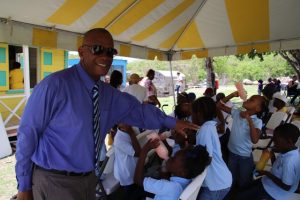 Hon. Eric Evelyn, Minister of Culture on Nevis, interacting with students at the at the Ministry of Tourism’s Heritage Village Life, at the Nevisian Heritage Village on May  10, 2019, an event on its Exposition Nevis calendar of activities