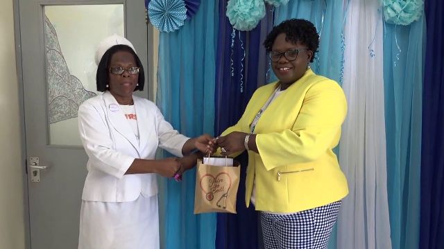 (L-r) Mrs. Aldris Pemberton Dias, Matron at the Alexandra Hospital, one of 116 nurses receiving a token of appreciation from Hon. Hazel Brandy-Williams, Junior Minister of Health on Nevis, on May 10, 2019