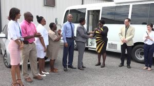 Hon. Hazel Brandy-Williams, Junior Minister of Health on Nevis hands over the keys of a mobile medical unit, a gift from the government and people of Japan to Dr. Judy Nisbett, Medical Officer of Health in the Ministry of Health on May 29, 2019, at the Nevis Disaster Management Department grounds 
