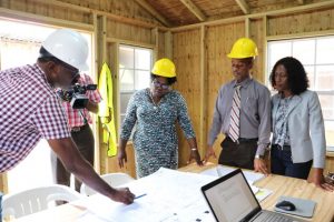 Mr. Billy Claxton, Project Manager of the Alexandra Hospital Expansion Project, shows layout of the project to (l-r) Hon. Hazel-Brandy Williams, Junior Minister of Health; Mr. Gary Pemberton, Hospital Administration; and Mrs. Shelisa Martin-Clarke, Acting Permanent Secretary in the Ministry of Health; during a walk-through of the project on Thursday, May 23, 2019