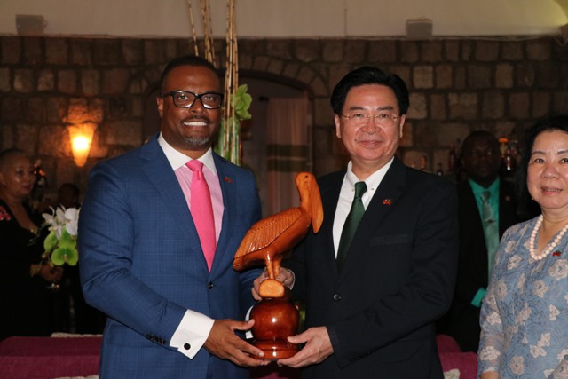 (L-r) Hon. Mark Brantley, Minister of Foreign Affairs and Aviation, and Premier of Nevis presents a gift to Dr. the Hon. Jaushieh Wu, Foreign Affairs Minister of the Republic of China (Taiwan) during his inaugural visit to the Federation, at a reception at the Montpelier Plantation Inn on May 28, 2019 while Mrs Wu looks on