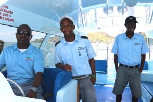 (L-r) Water Taxi Operator on Nevis Capt. Wincent Perkins of Islander Watersports accompanied by Mr. Raymundo Nisbett, First Mate; and Mr. Verez Dore, Second Mate on board “Point Setter” a 14 seater boat in the company’s fleet of seven