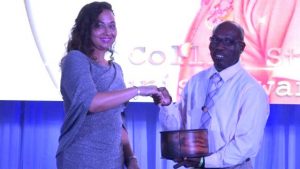 Mr. Collin Stapleton receives the Patron’s Award from First Lady Mrs. Sharon Brantley at the Ministry of Tourism’ s Nevis Tourism Industry Awards ceremony on May 25, 2019, on the grounds of Government House at Bath Plain