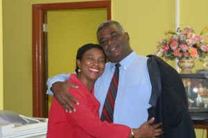 Hon. Malcolm Guishard Minister of Information in the Nevis Island Administration at the Department of Information greets staff member Mrs. Joan Stapleton-Pemberton at one of his many visits in February 2005 (file photo)