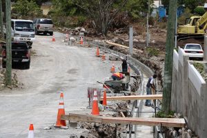 Workers from the Public Works Department working on the construction of U-drains in the Craddock Road Rehabilitation Project on July 23, 2019