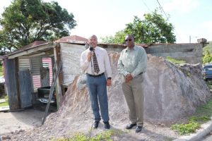 (l-r) Hon. Spencer Brand, Minister of Communications and Works, and Mr. Denzil Stanley, Principal Assistant Secretary in the Ministry of Communications and Works at the improved junction at Chicken Stone along the Island Main Road in Gingerland on August 20, 2019   