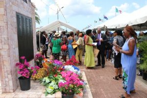 The MV Christena Disaster Memorial on Hunkins Drive adorned with colourful wreaths at the end of the 49th Anniversary Memorial Service for the MV Christena Disaster on August 01, 2019, a tragedy in which hundreds of persons perished and less than 100 survived