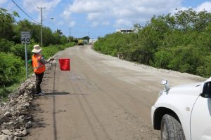 A flag lady with Surrey Paving & Aggregate Co. Ltd at work on the Island Main Road Rehabilitation and Safety Improvement Project on August 13, 2019