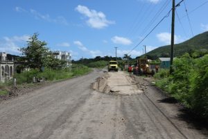 Base material being place on the road on August 13, 2019 in Phase 1 of the Island Main Road Rehabilitation and Safety Improvement Project from Cotton Ground to Cliff Dwellers